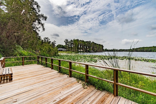 wooden terrace with a water view