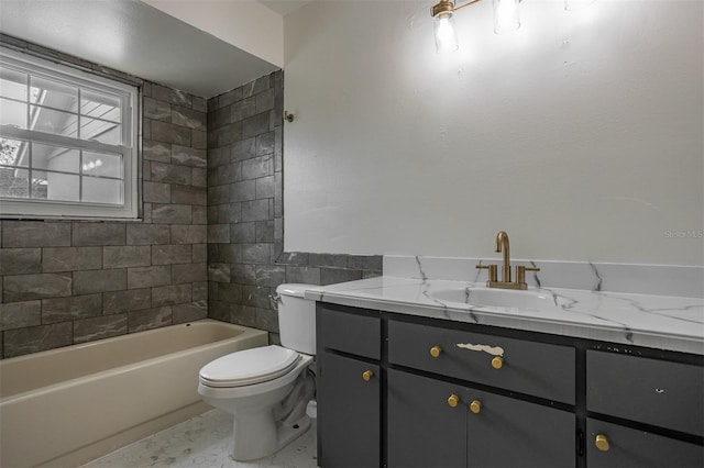 full bath with toilet, shower / bathing tub combination, tile walls, and vanity