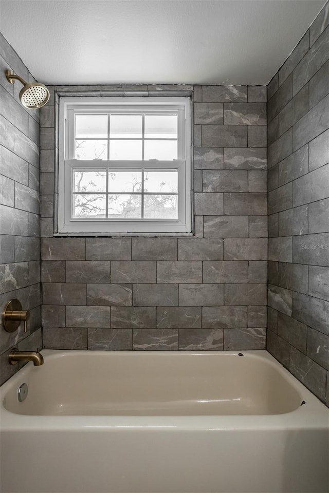 full bath featuring bathing tub / shower combination