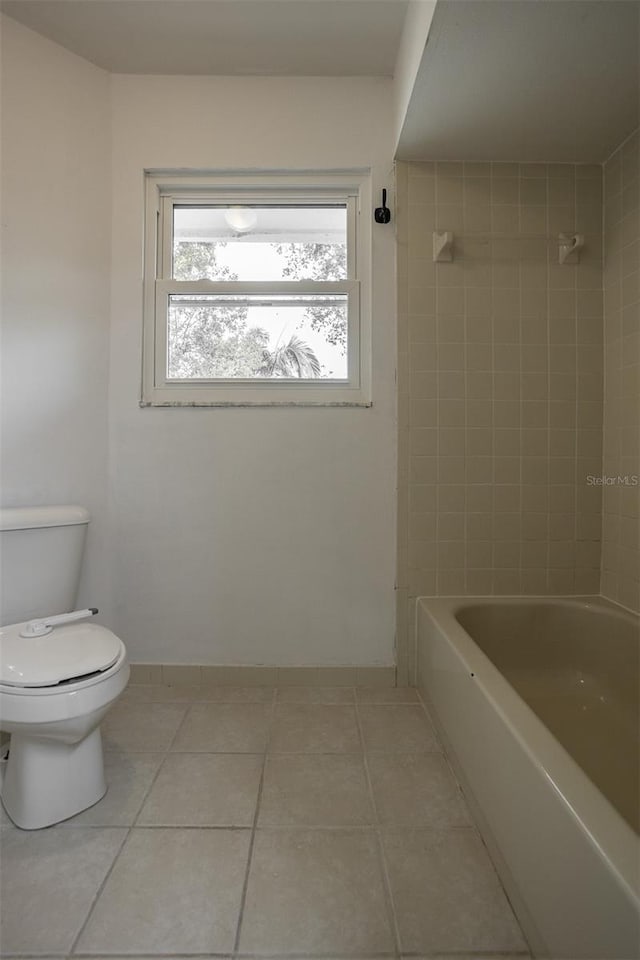 full bath with toilet, shower / bath combination, and tile patterned flooring