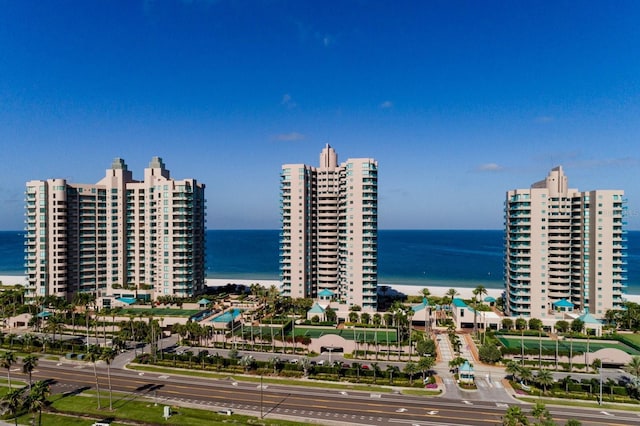 birds eye view of property with a city view and a water view