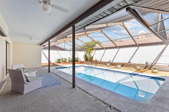 outdoor pool featuring ceiling fan, a patio area, and a lanai