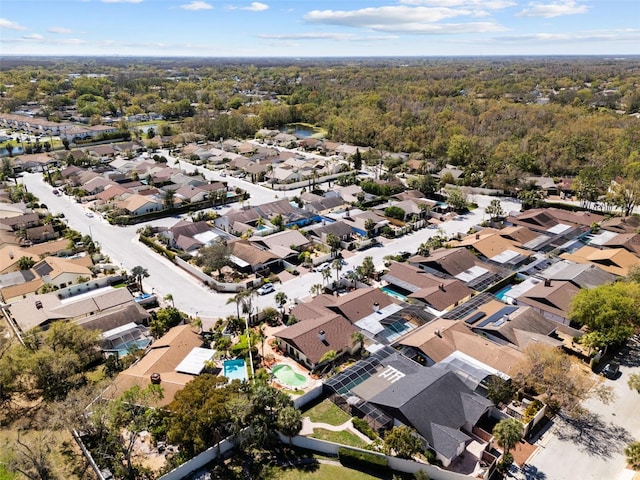 aerial view featuring a residential view and a view of trees