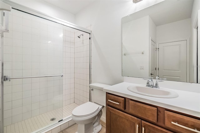 full bath featuring a stall shower, vanity, and toilet