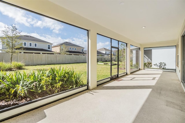 sunroom / solarium with a residential view