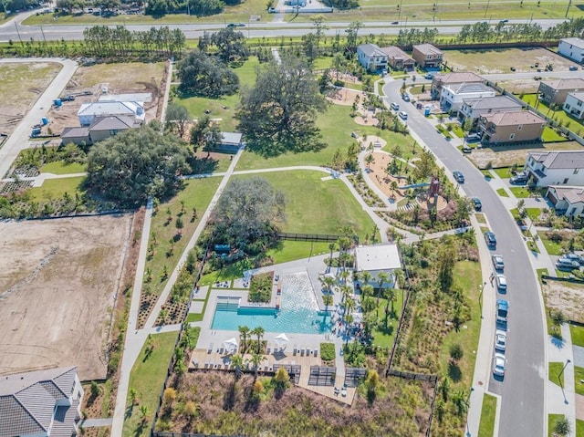 birds eye view of property with a residential view