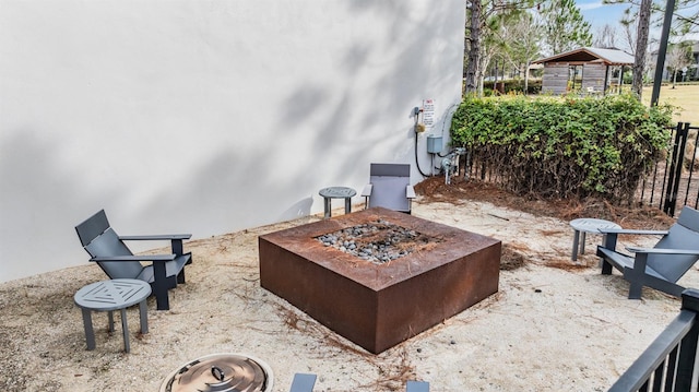 view of patio / terrace featuring a fire pit