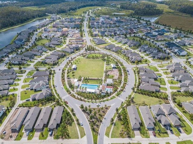 drone / aerial view with a residential view and a water view