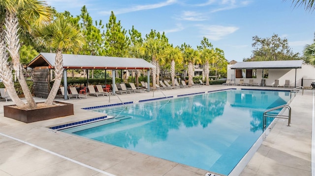 community pool with a patio area