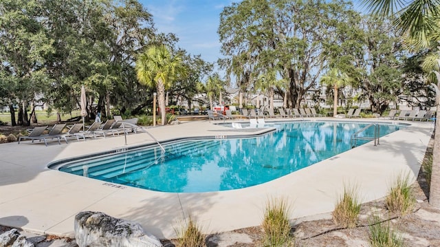 community pool featuring a patio area