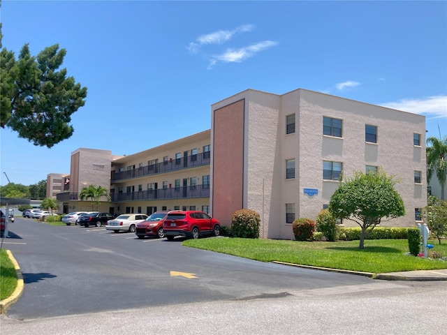 view of property with uncovered parking