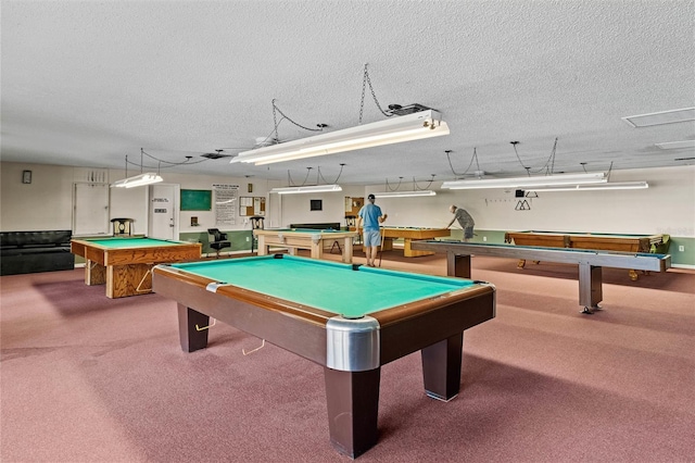 recreation room featuring billiards, carpet, and a textured ceiling