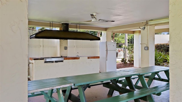 view of patio / terrace featuring outdoor dining area and ceiling fan