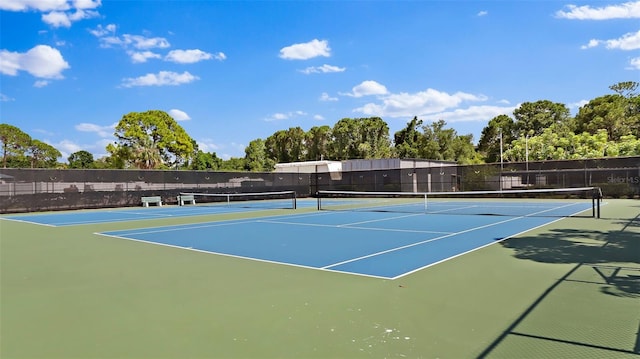 view of sport court with fence