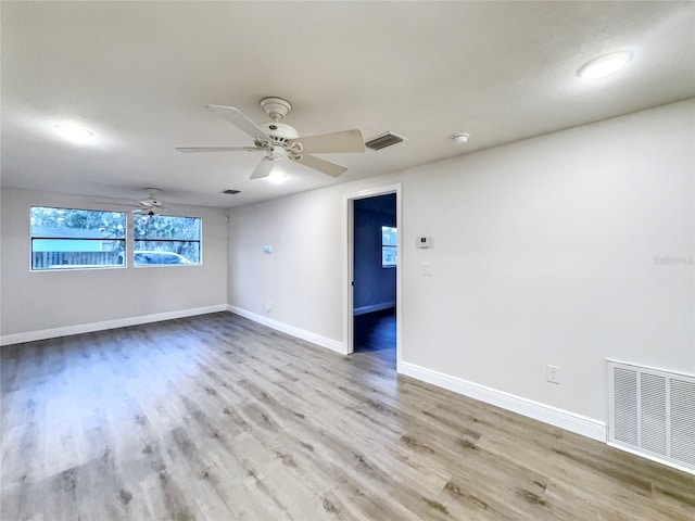 11201 Blendale Dr, Riverview, FL 33569 - empty room with light wood-style flooring, a ceiling fan, visible vents, and baseboards