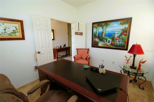 office area with light carpet and baseboards