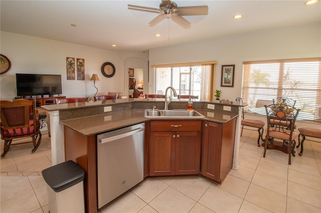 kitchen with recessed lighting, a sink, open floor plan, stainless steel dishwasher, and a center island with sink