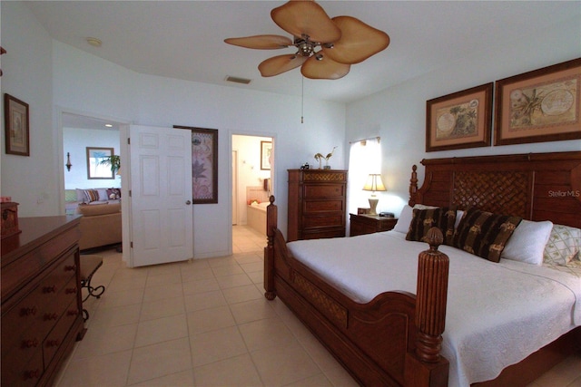 bedroom featuring light tile patterned floors, ceiling fan, connected bathroom, and visible vents