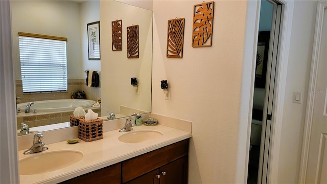 full bathroom featuring double vanity, a sink, and a bath