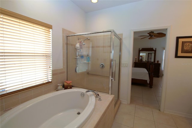 ensuite bathroom with ensuite bathroom, ceiling fan, a shower stall, a bath, and tile patterned floors