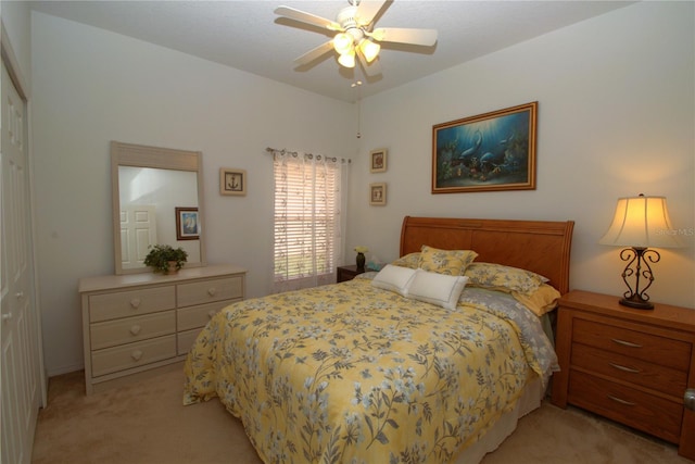 bedroom with ceiling fan and light colored carpet