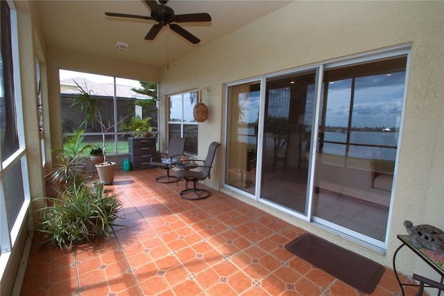 sunroom featuring visible vents and ceiling fan