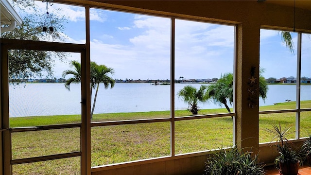 sunroom with a water view