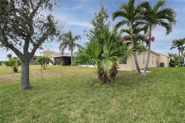 view of yard featuring central AC