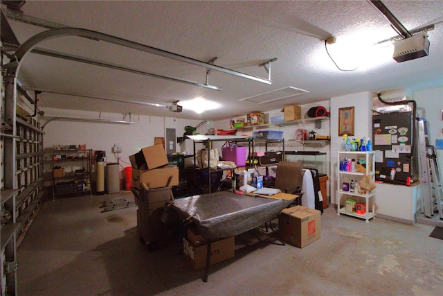 garage with electric panel and a garage door opener