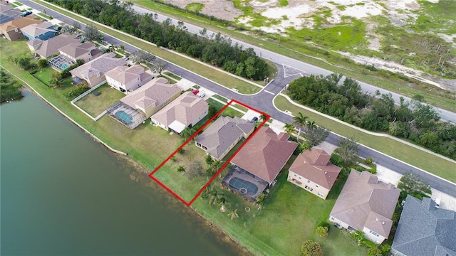 birds eye view of property featuring a residential view and a water view