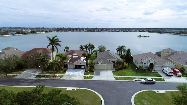 aerial view with a water view and a residential view