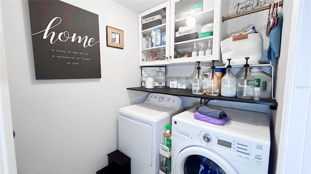 washroom with laundry area and washing machine and clothes dryer