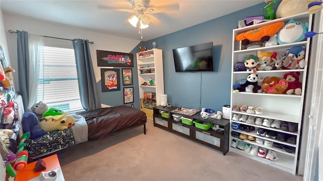 bedroom with a ceiling fan and carpet flooring