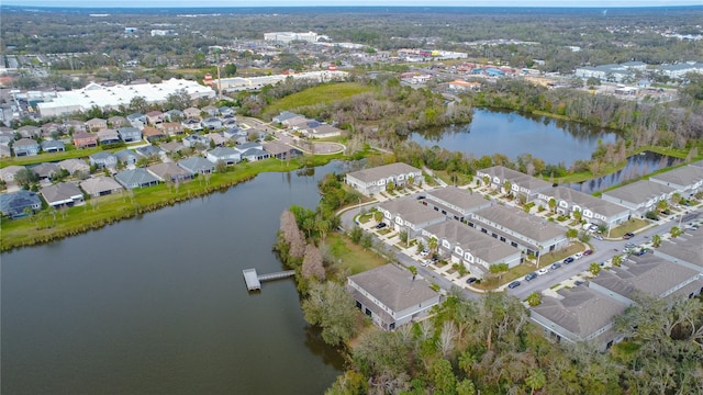 birds eye view of property with a residential view and a water view