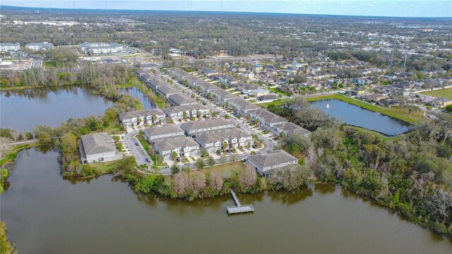 birds eye view of property featuring a water view and a residential view