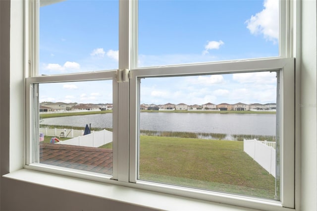 water view with fence and a residential view