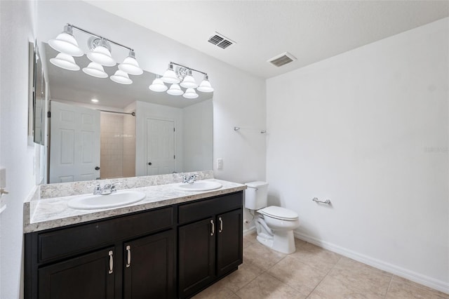 full bathroom with toilet, visible vents, and a sink