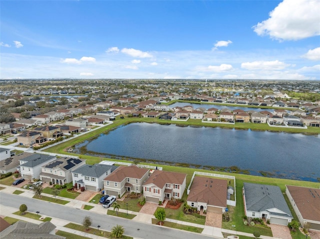 bird's eye view featuring a water view and a residential view