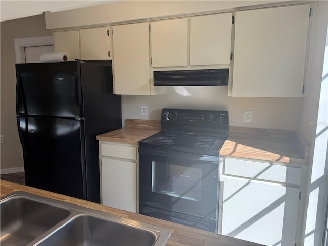 kitchen with under cabinet range hood, black appliances, light countertops, and a sink