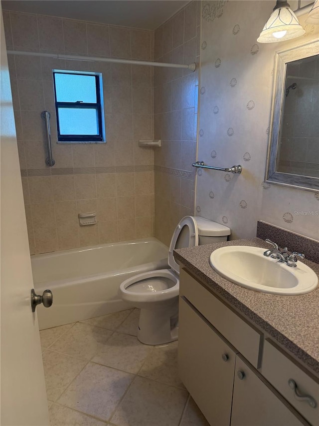 full bathroom with toilet, wallpapered walls, vanity, tile patterned flooring, and shower / bathtub combination