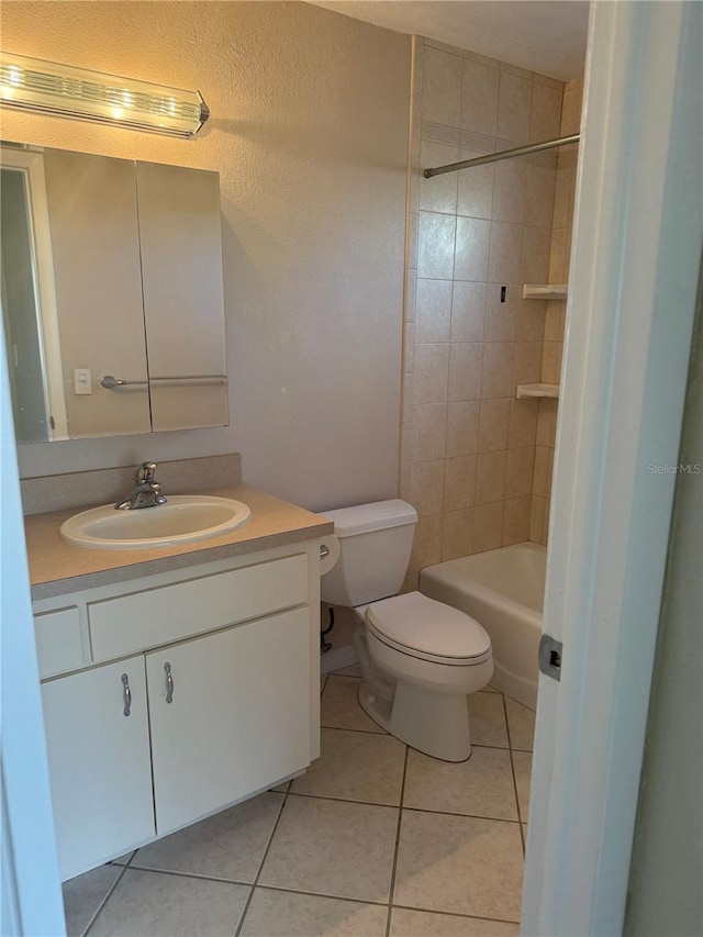 full bath with shower / bathing tub combination, toilet, vanity, and tile patterned flooring