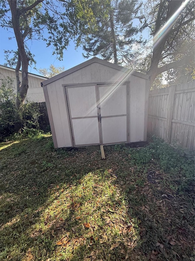 view of shed with fence