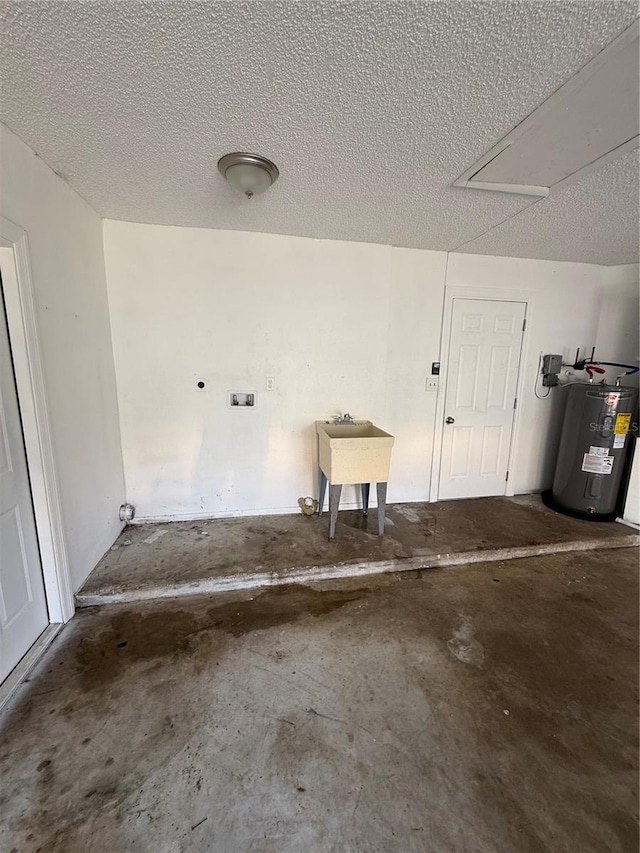 garage featuring water heater and a sink