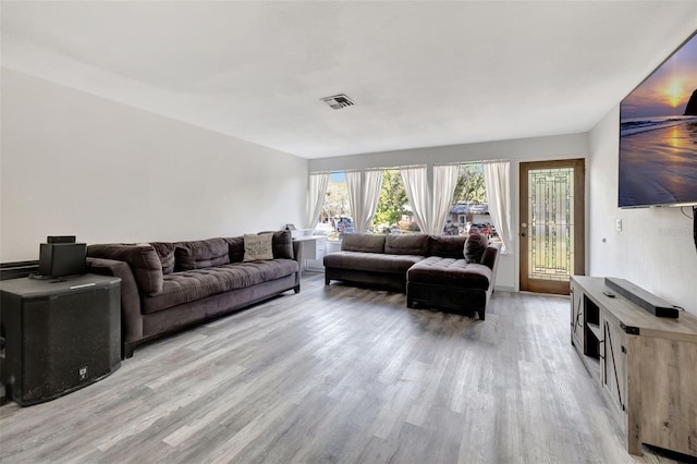 4716 Gazania St, New Port Richey, FL 34652 - living area with light wood finished floors and visible vents