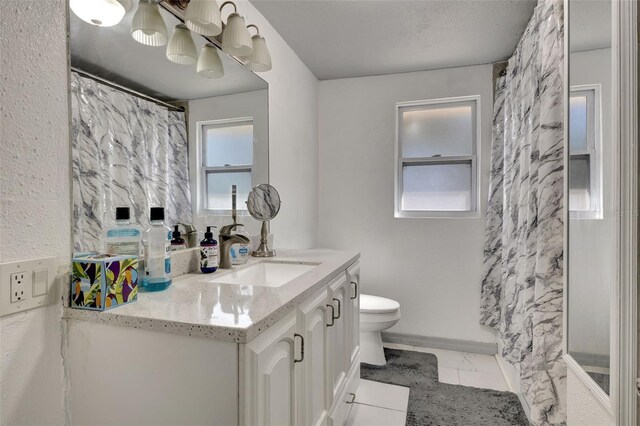 4716 Gazania St, New Port Richey, FL 34652 - bathroom featuring marble finish floor, toilet, an inviting chandelier, vanity, and baseboards