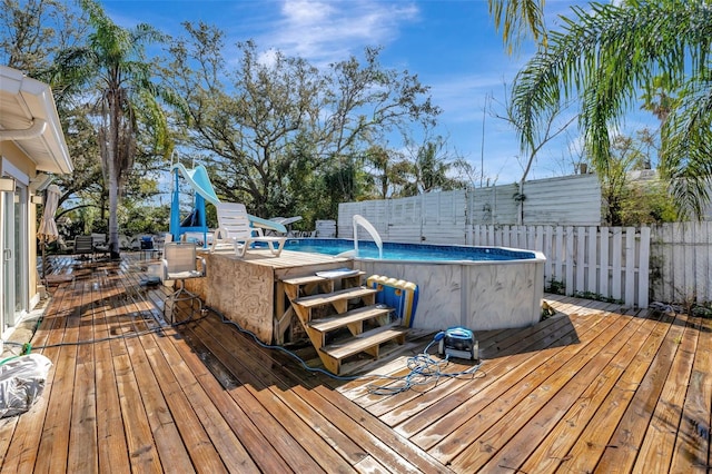 4716 Gazania St, New Port Richey, FL 34652 - deck featuring fence and an outdoor pool
