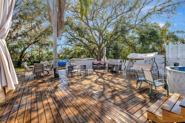 4716 Gazania St, New Port Richey, FL 34652 - wooden terrace with a shed, outdoor dining area, and an outdoor structure