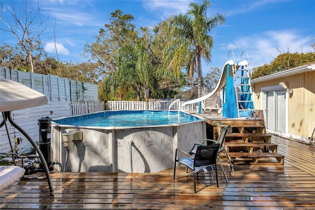 4716 Gazania St, New Port Richey, FL 34652 - view of swimming pool with fence, a fenced in pool, and a water slide