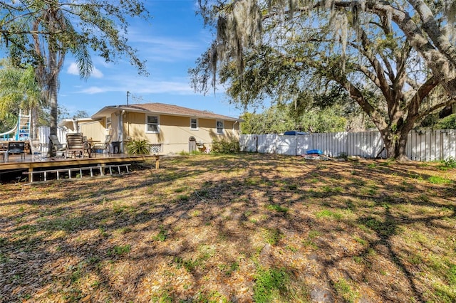 4716 Gazania St, New Port Richey, FL 34652 - view of yard with fence and a deck