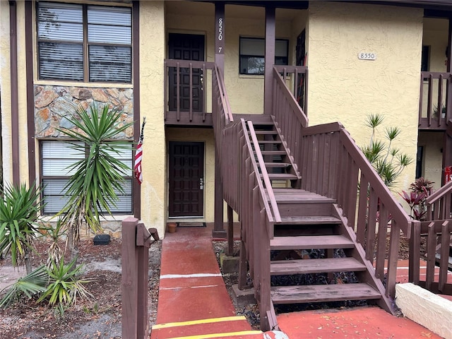 entrance to property with stucco siding